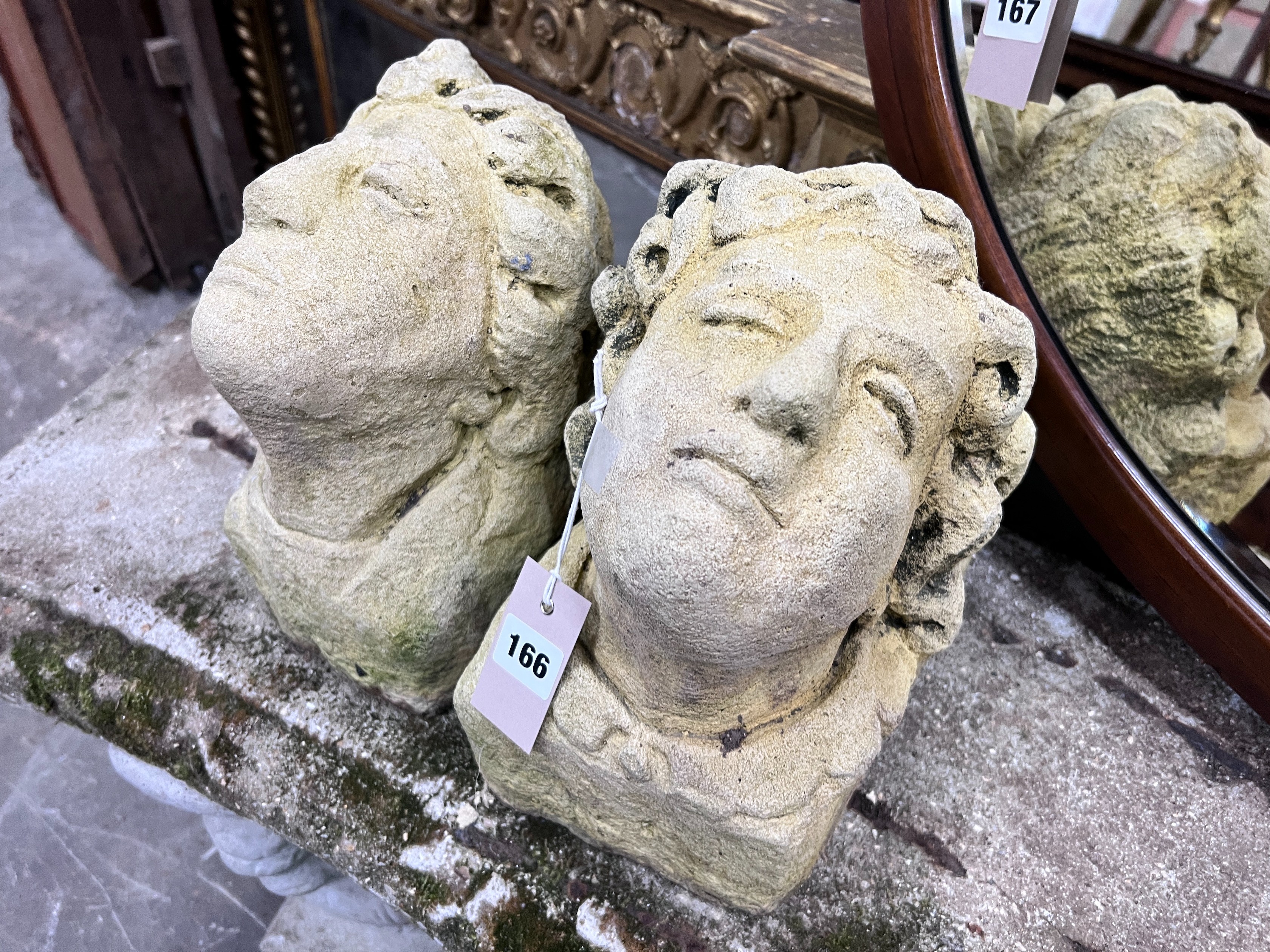 A pair of reconstituted stone corbels, height 22cm *Please note the sale commences at 9am.